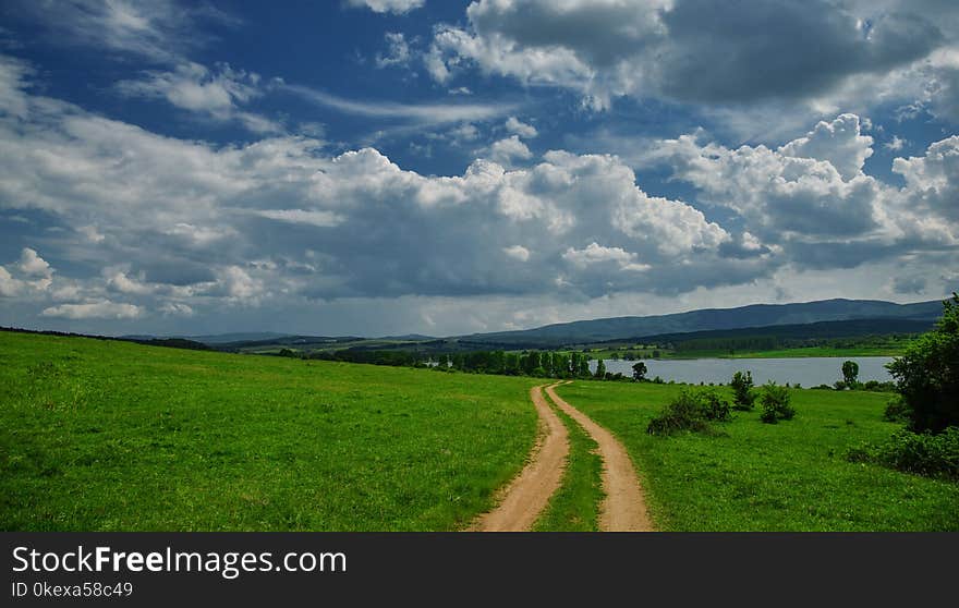 Incredibly beautiful Nature.Sun,lake.Landscape, panorama of beautiful Green nature. Sky.Amazing colorful clouds.