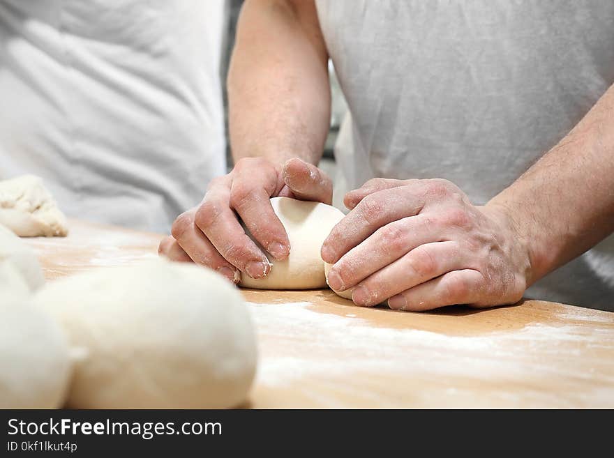 Baker, pastry chef prepares the dough for baked goods. Baker, pastry chef prepares the dough for baked goods