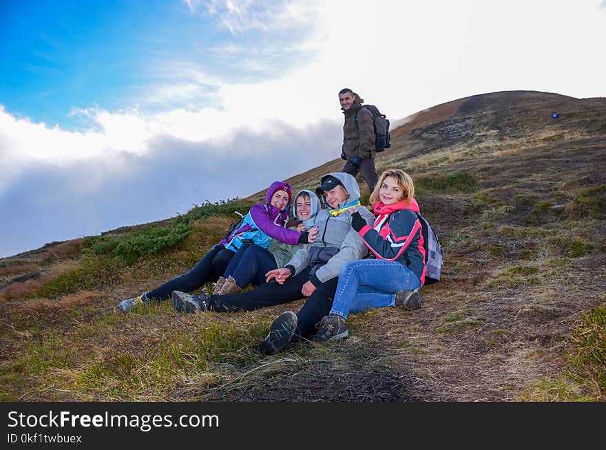 Group of People Hiking Mountain