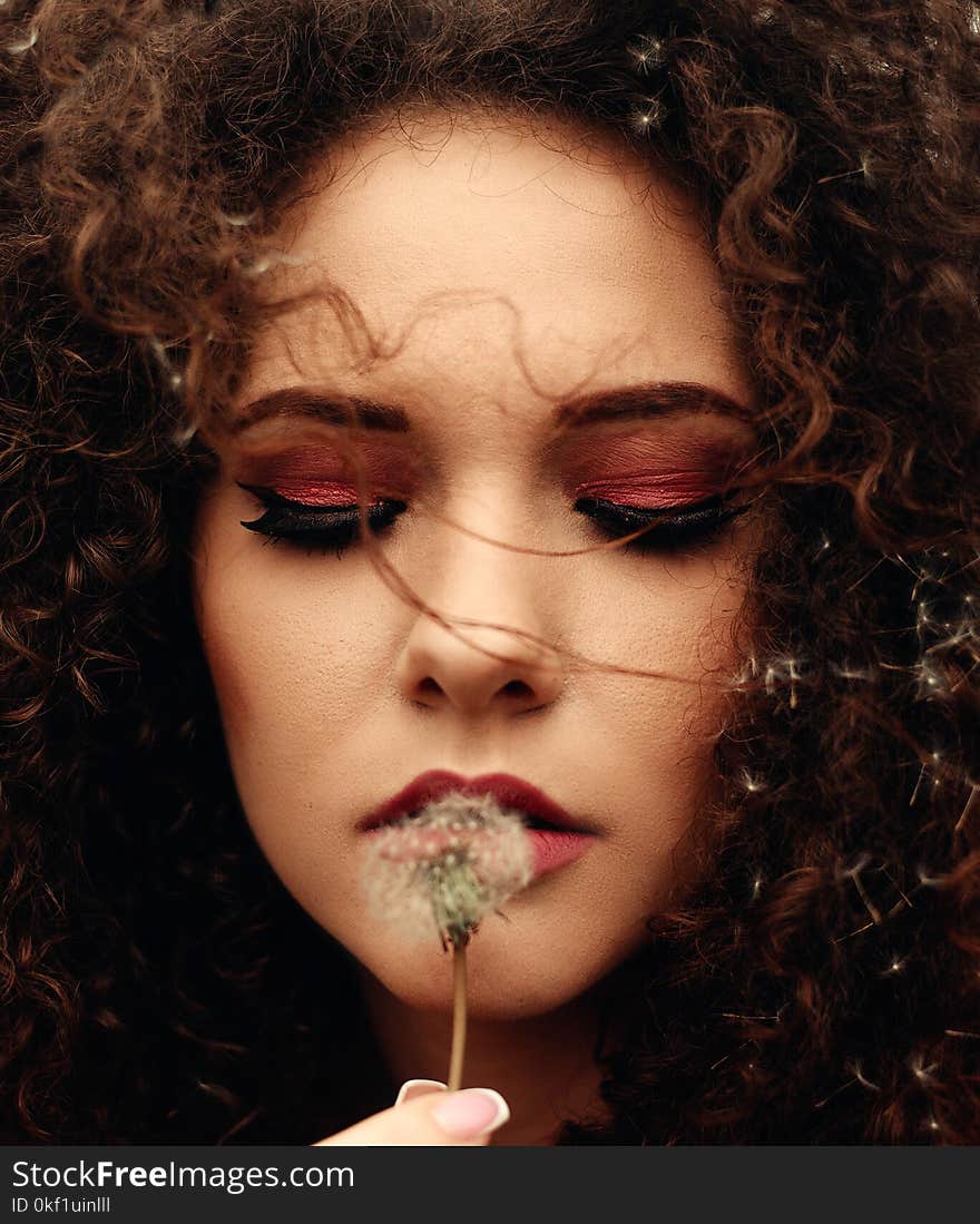 Close-Up Photo of Woman Holding Dandelion Flower