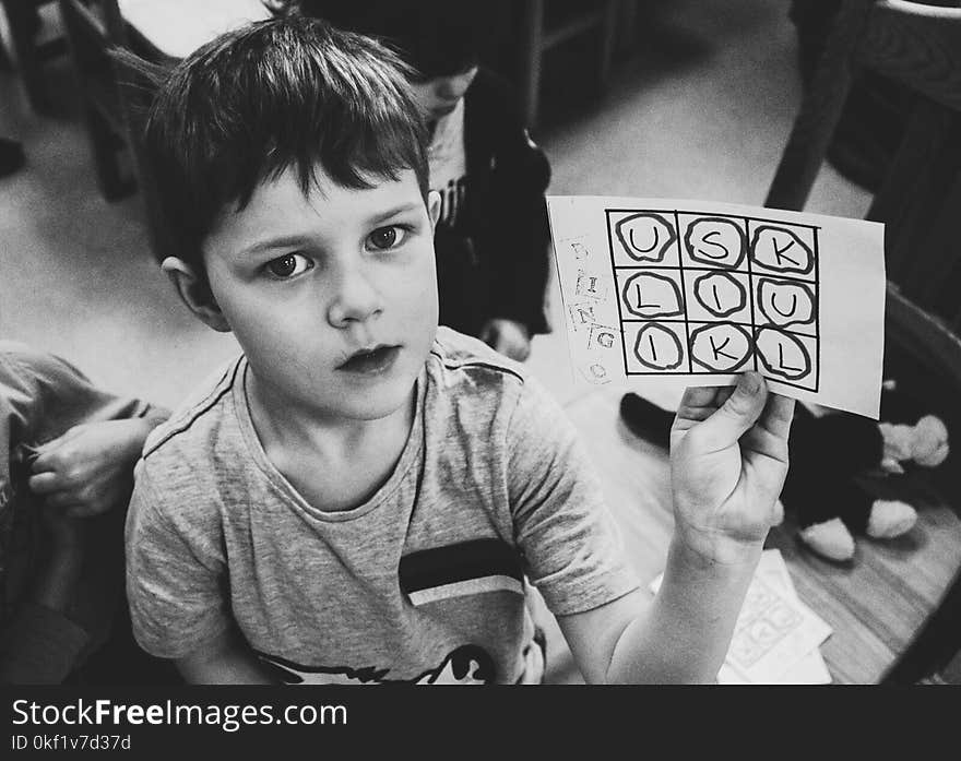 Boy Holding Paper With Text