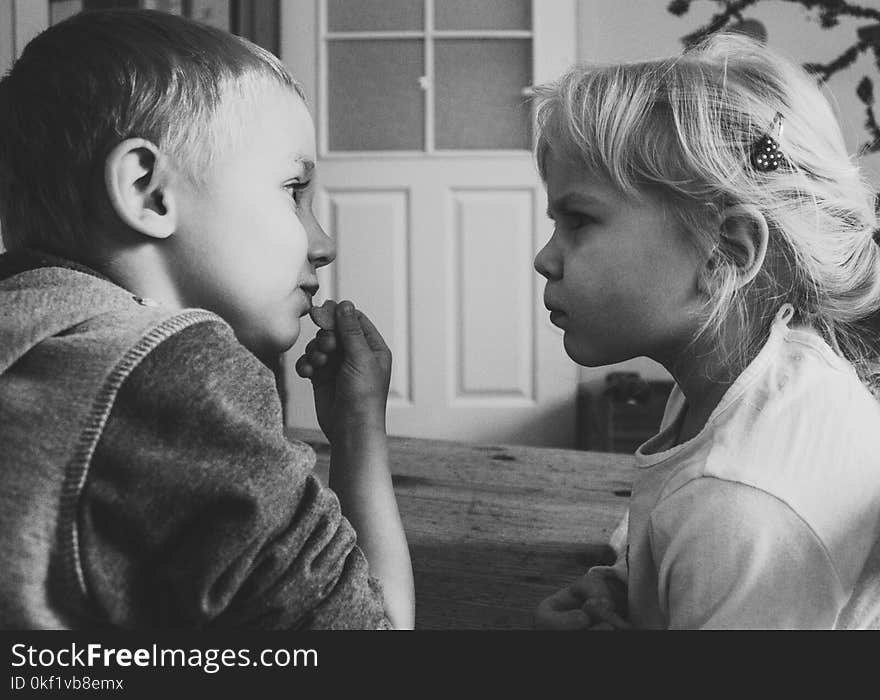 Grayscaled Photo of Boy and Girl