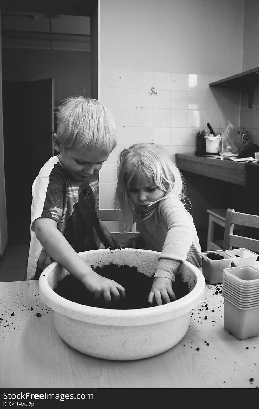 Two Boy and Girl Holding Mud