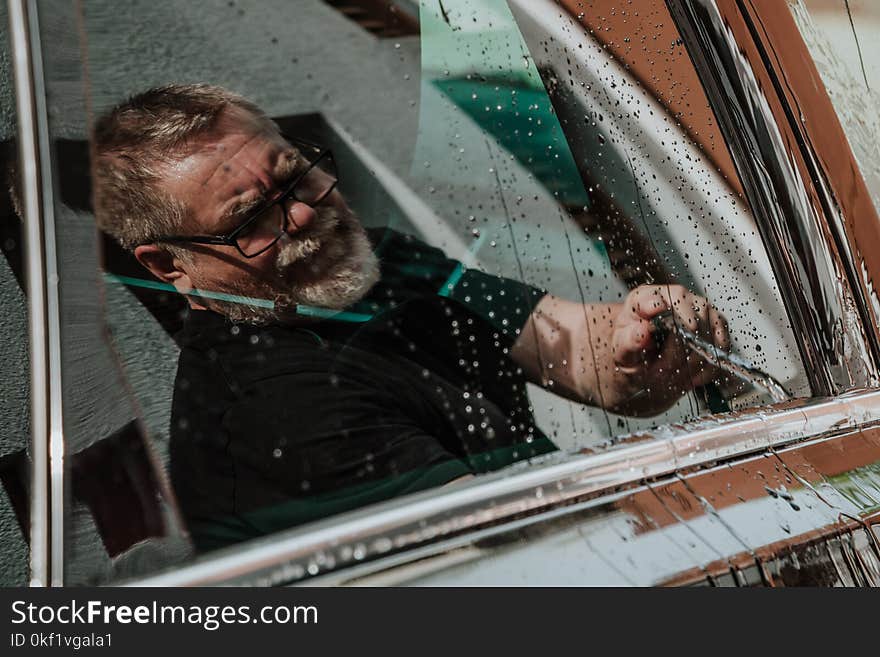 Man Wearing Black Shirt Cleaning