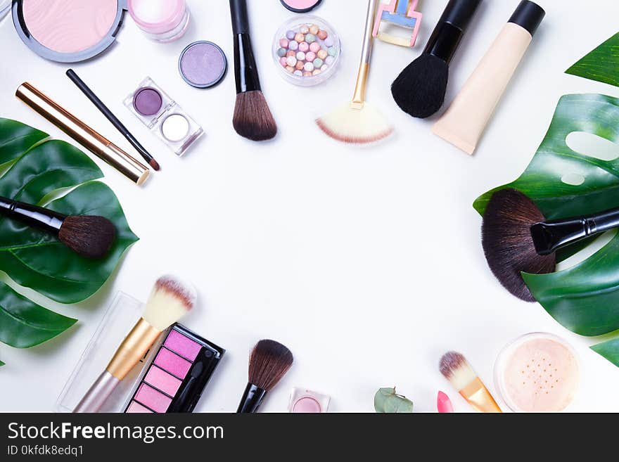 Professional makeup tools with cosmetic beauty products frame , flatlay on white background