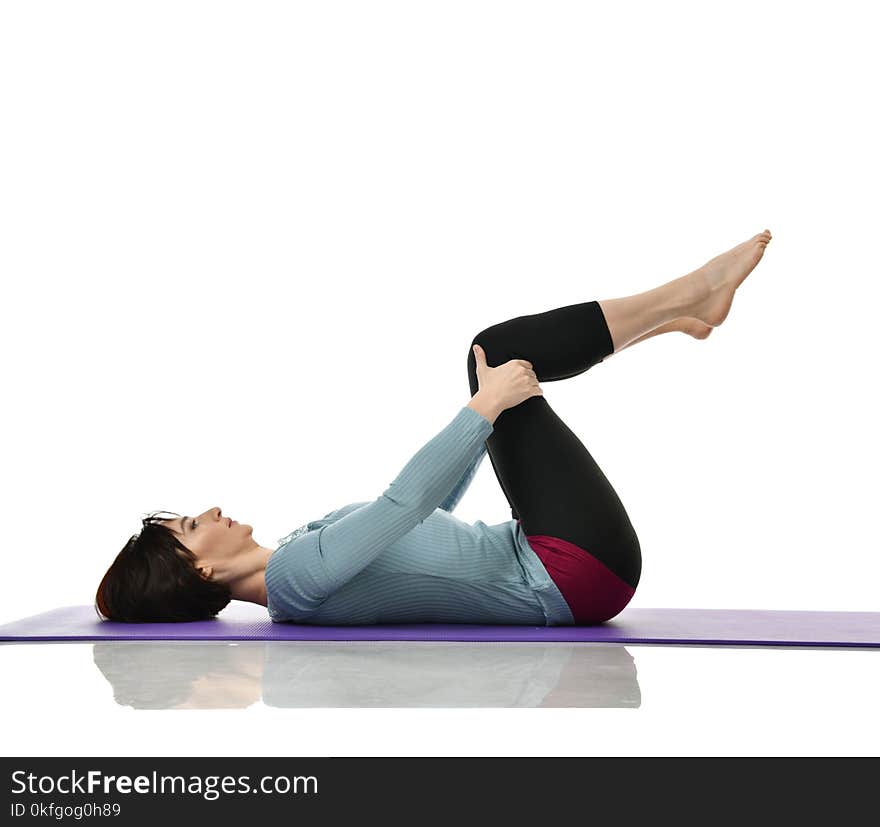 Mother woman exercising doing postnatal workout. Female fitness instructor holds legs in gym and workout exercises for abdominals with athletic muscle body over white background