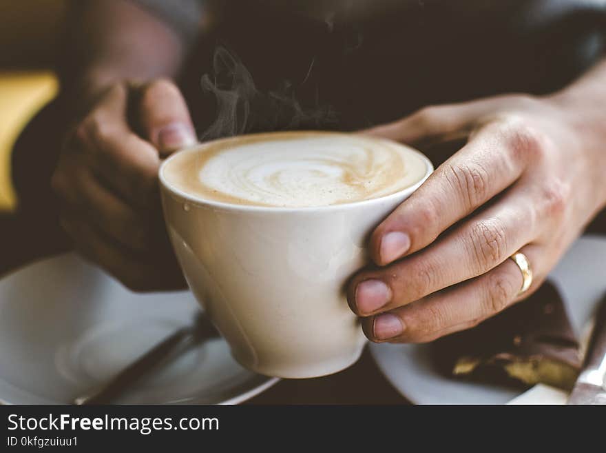 Close-Up Photo of Person Holding Cup of Coffee