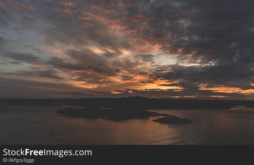 Silhouette of Island during Sunset