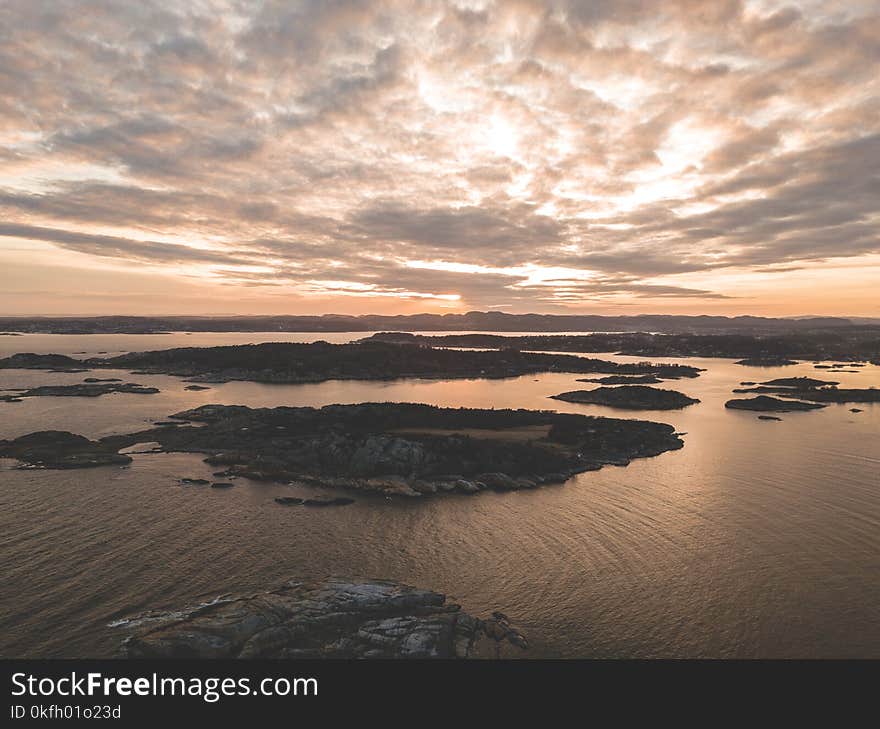 Aerial Photography of Mountains Near Body of Water