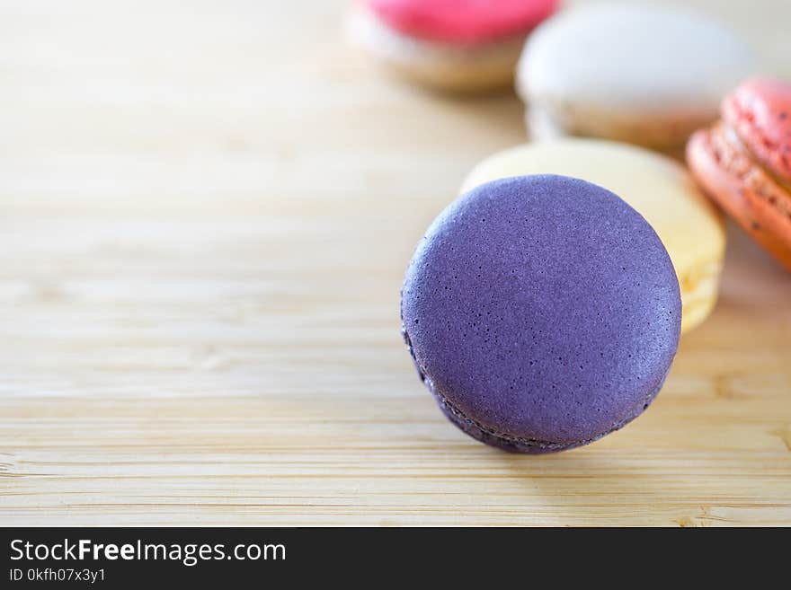 Photo of Macarons on Brown Wooden Surface