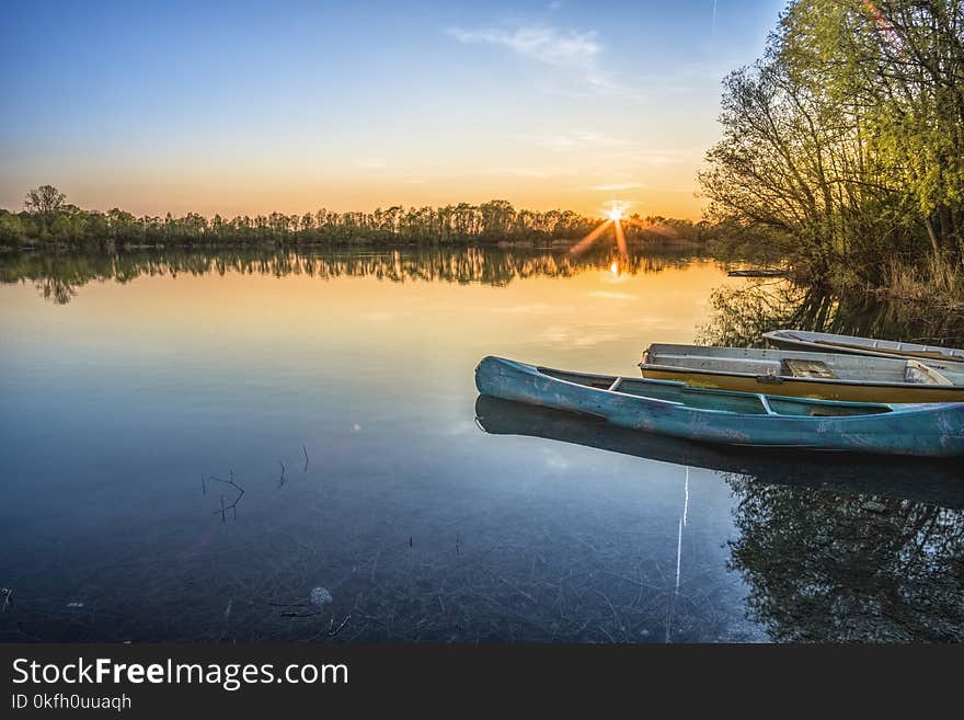 Blue Canoe and Body of Water