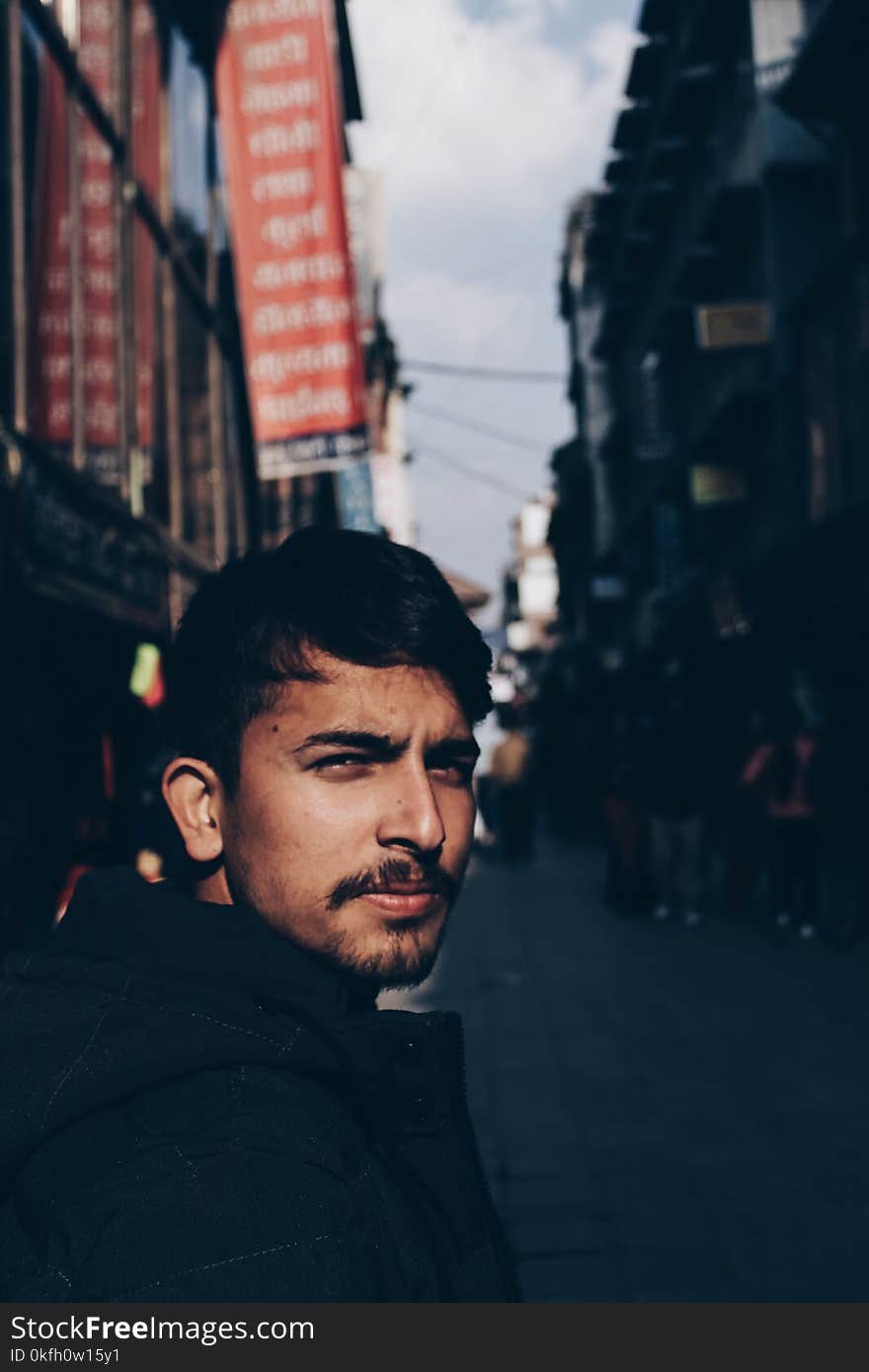 Selective Focus Photography of Man Wearing Black Top