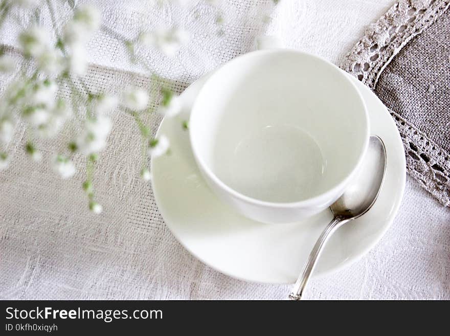 White Ceramic Tea Cup With Saucer and Spoon