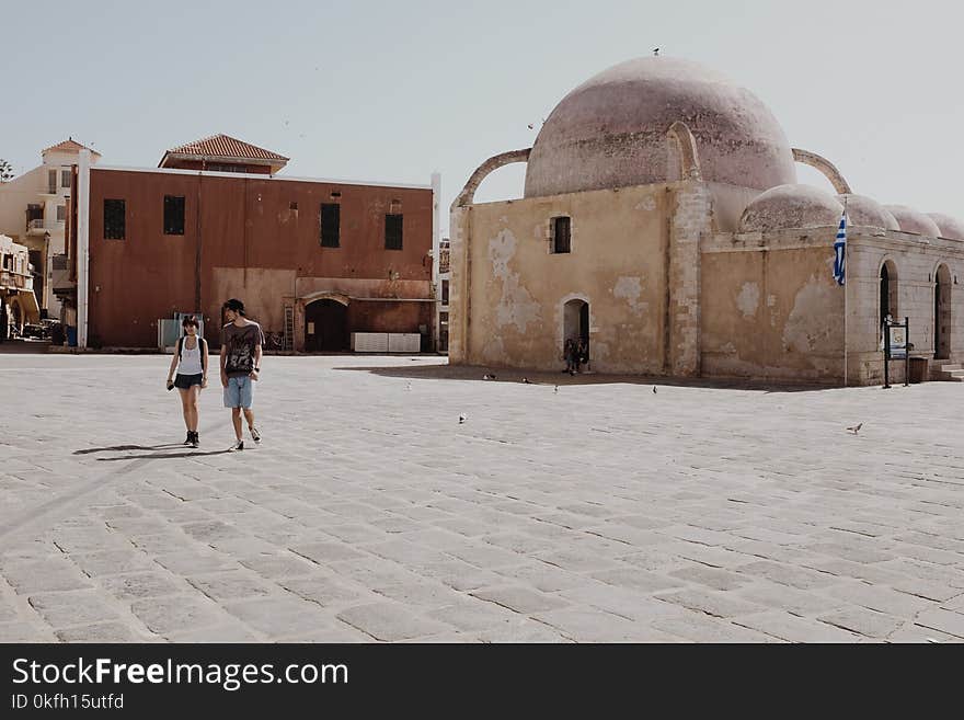 Couples Walking in Front of Dome Building