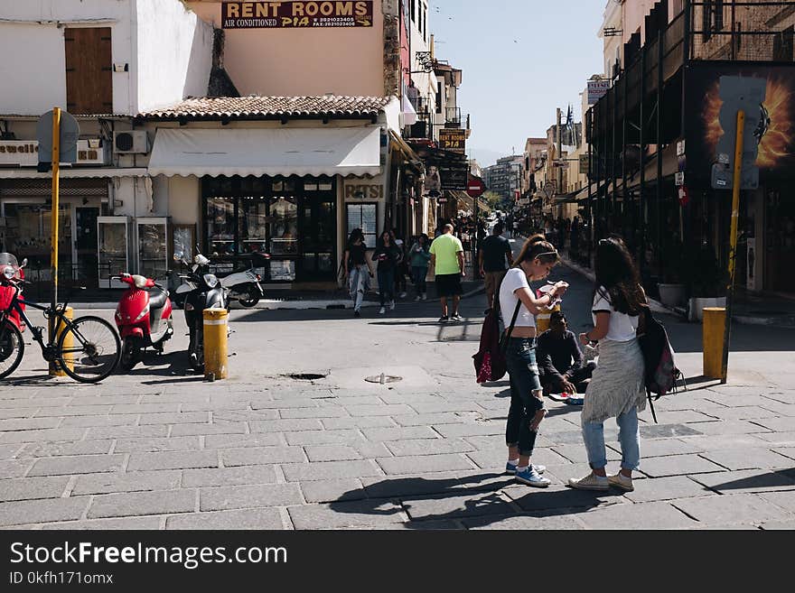 People Near a Brown Building at Daytime