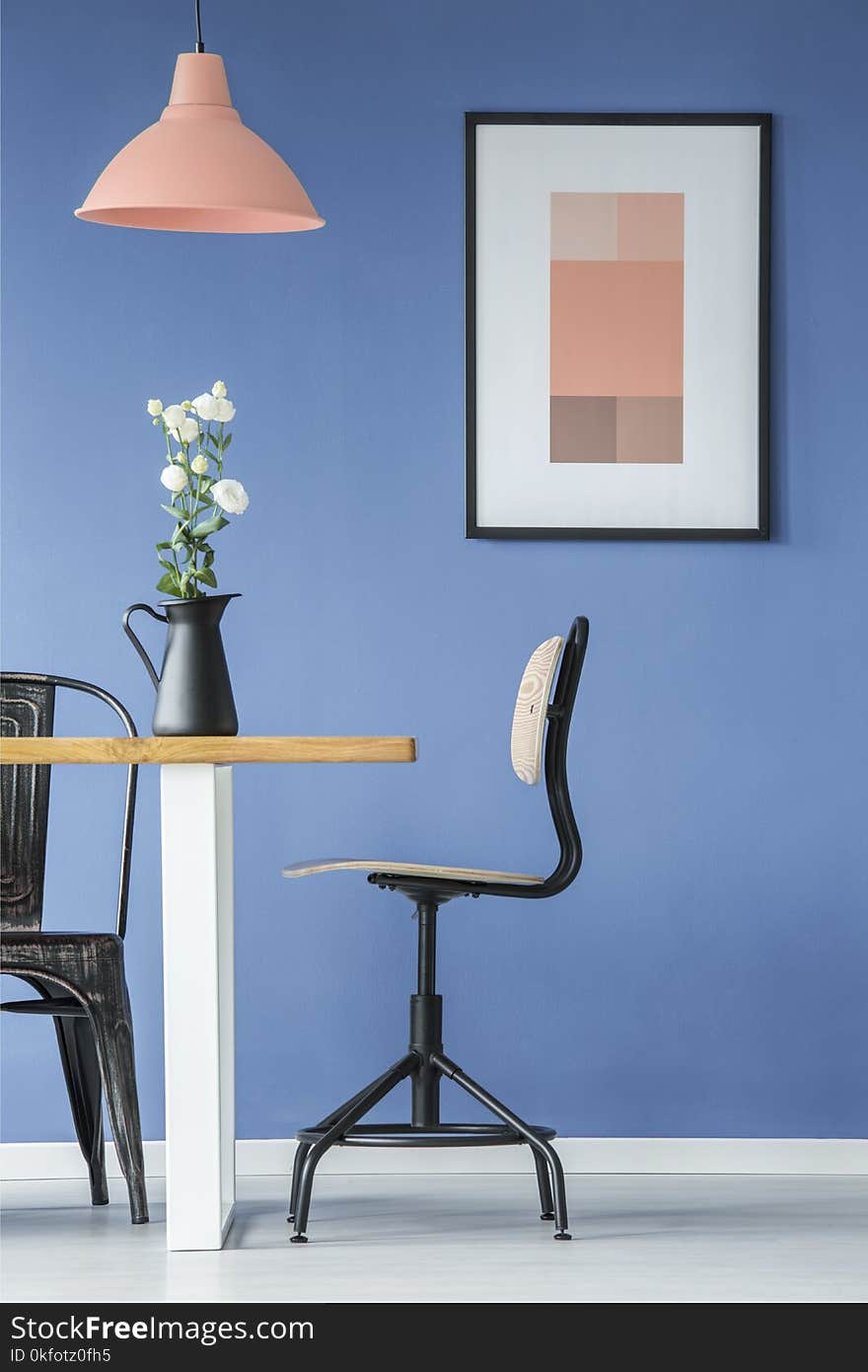 Interior with chairs, table, poster