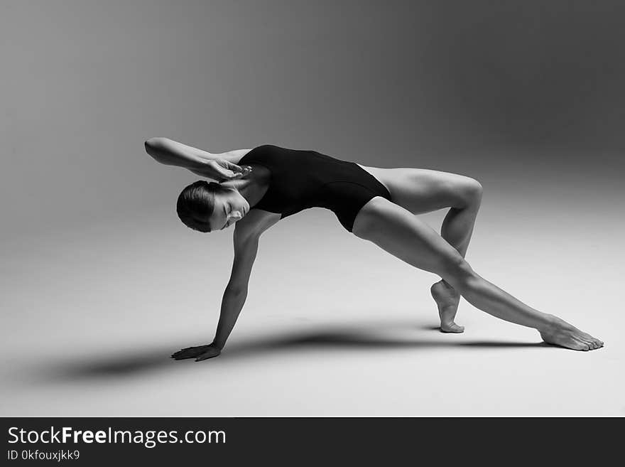 Young beautiful athlete is posing in studio