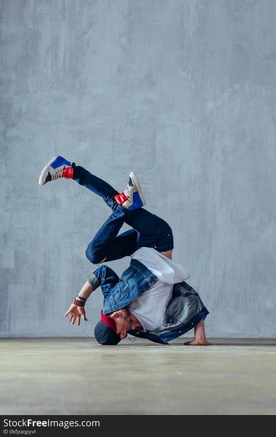 Young beautiful male dancer posing in studio