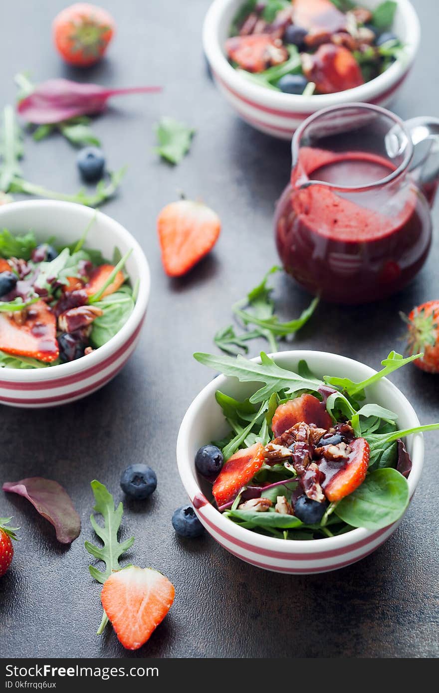 Fresh salad with lettuce, berries and blueberry vinaigrette. Fresh salad with lettuce, berries and blueberry vinaigrette