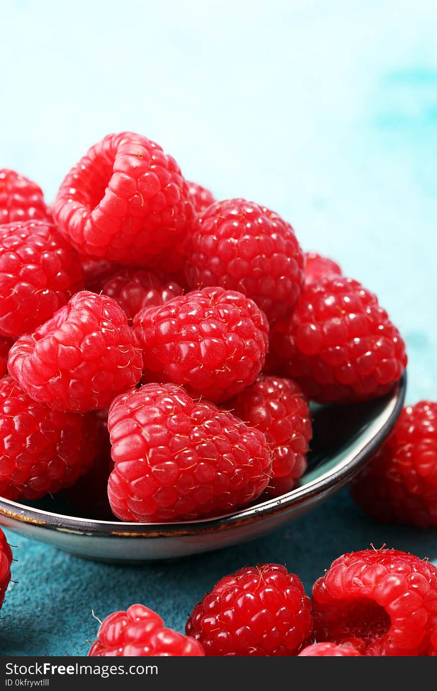 Raspberries. Raspberry on blue background. Summer and healthy food concept