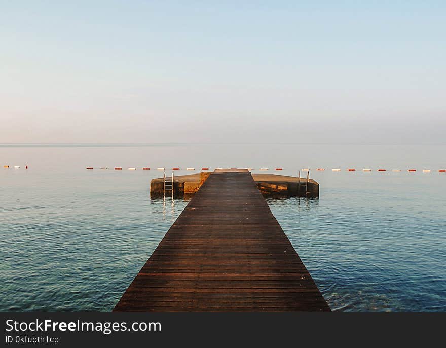 A wooden pier in blue Adriatic sea in Budva, Montenegro