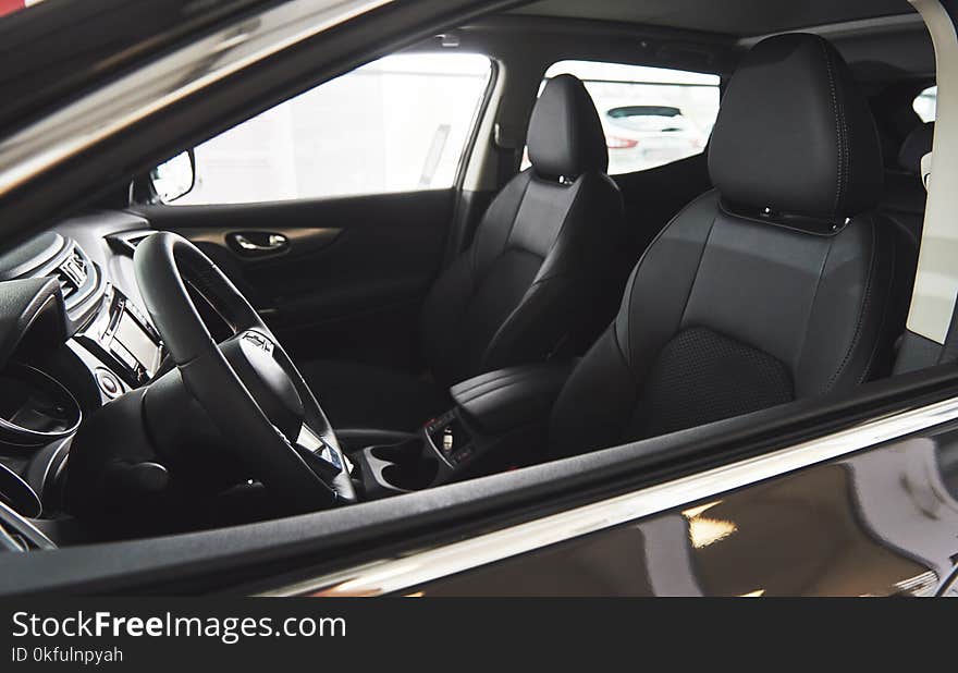 Dark luxury car Interior - steering wheel, shift lever and dashboard. Dark luxury car Interior - steering wheel, shift lever and dashboard