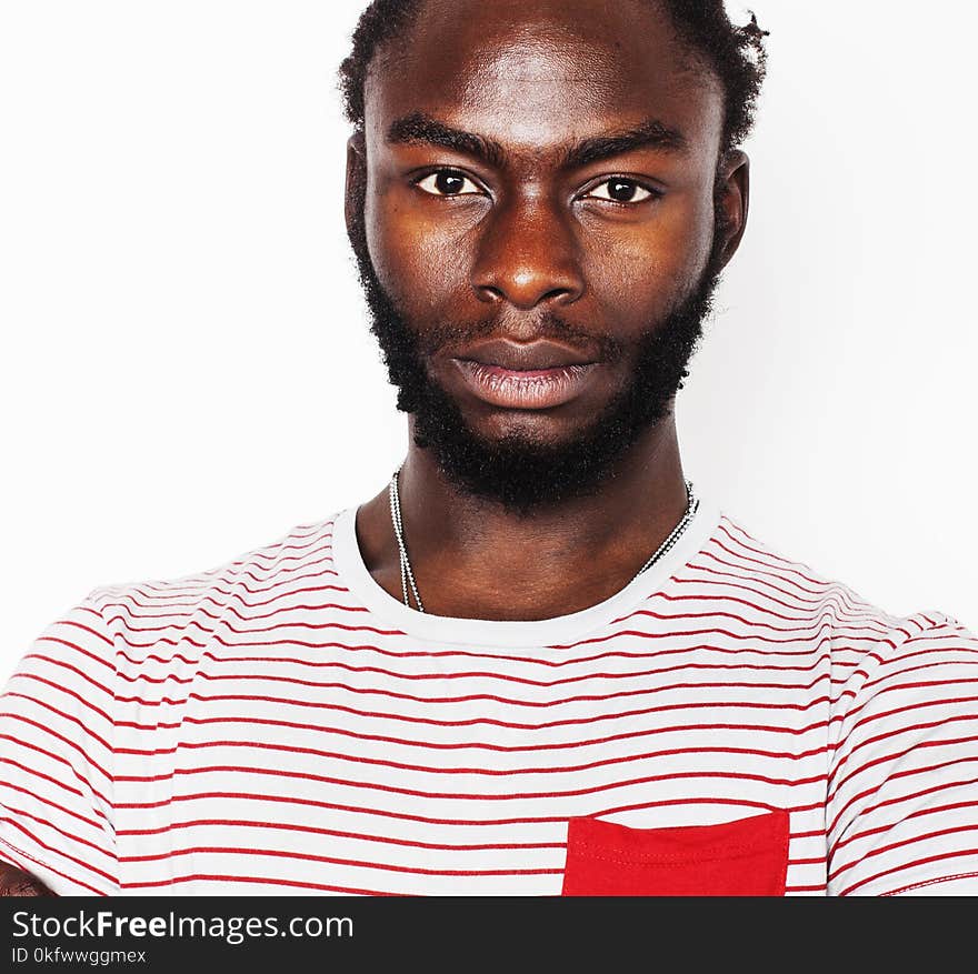 Young handsome afro american boy stylish hipster gesturing emotional isolated on white background smiling, people lifestyle concept close up