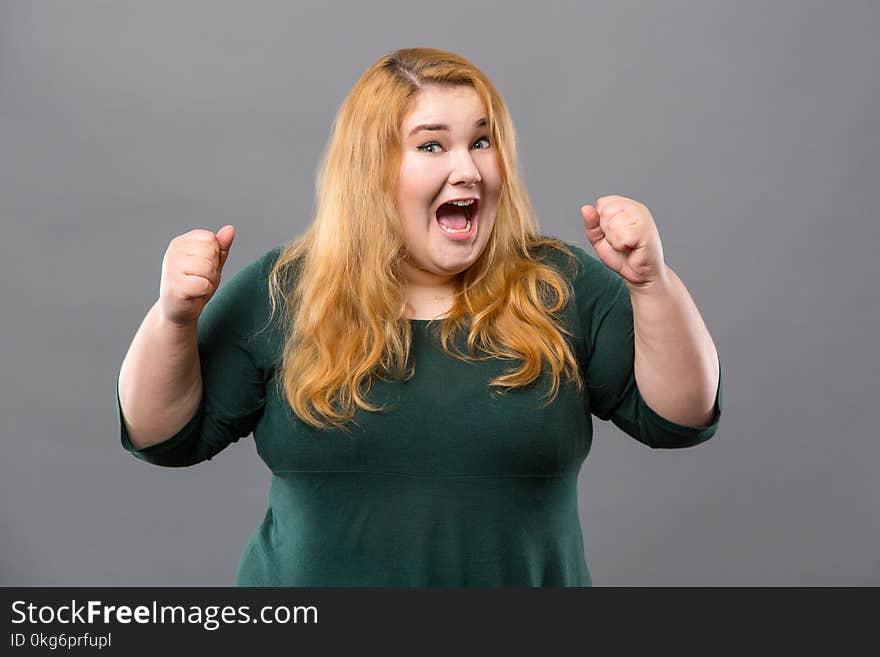 Overwhelmed by emotions. Pleasant emotional woman looking at you while being overwhelmed by emotions