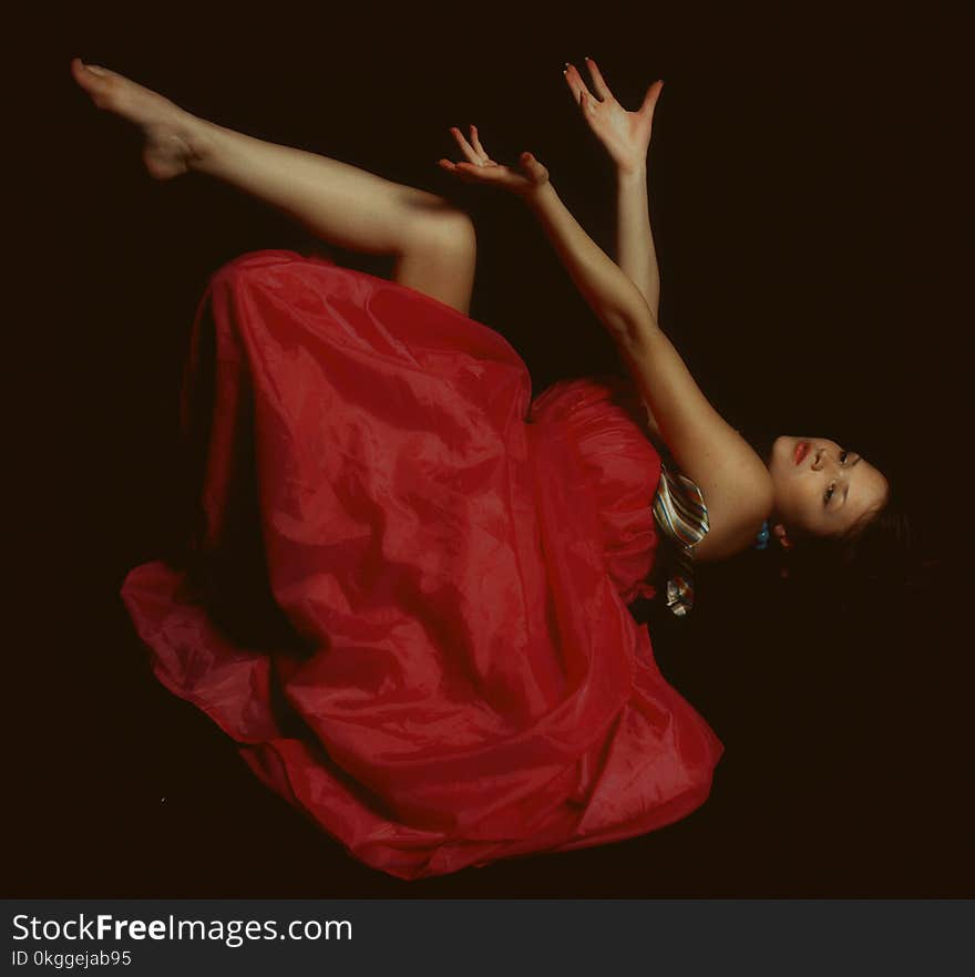 Photo of Woman in Red Dress