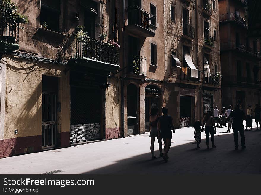 Photo of People Walking in the Street