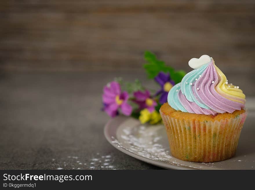 Close Up Photography of Cupcake on Gray Ceramic Plate