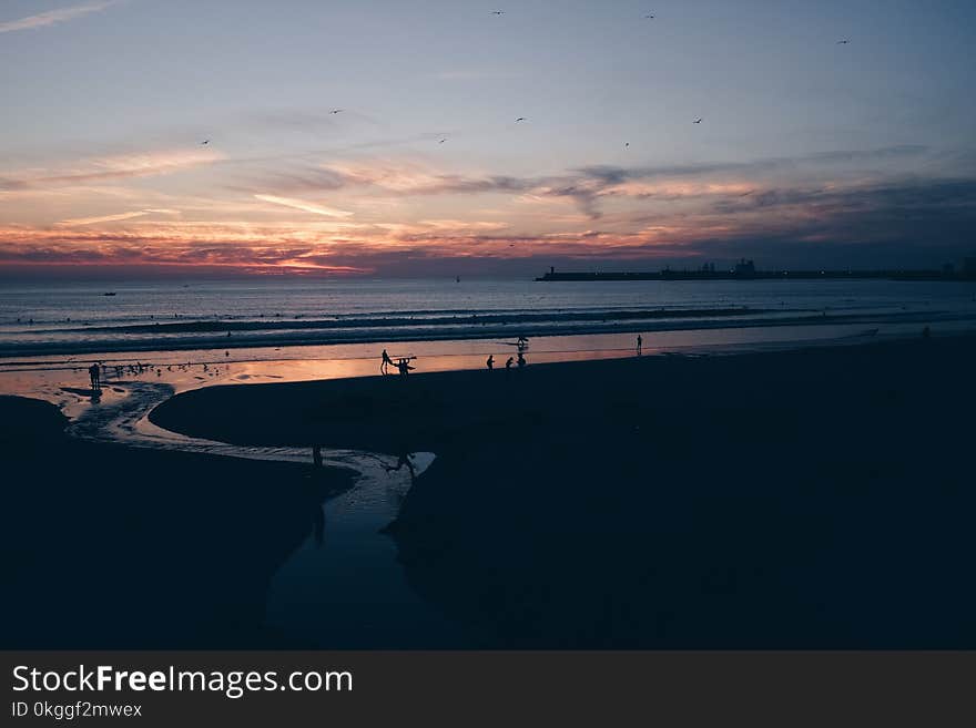 Silhouette Photo of Sea during Golden Hour