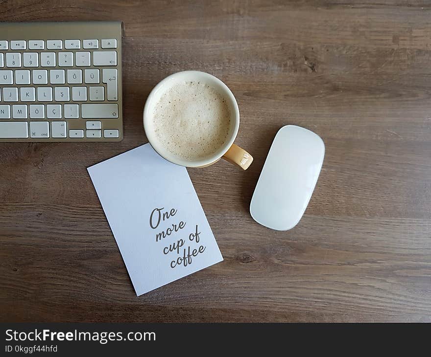 Apple Magic Mouse and White Ceramic Mug