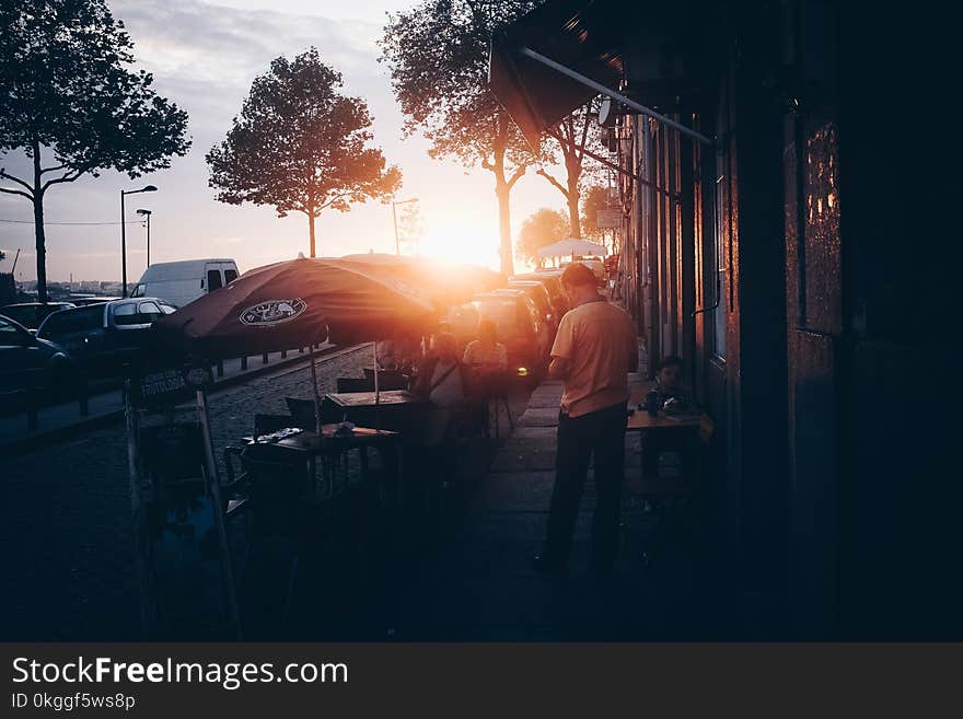 Photo of People Sitting Outside the Restaurant