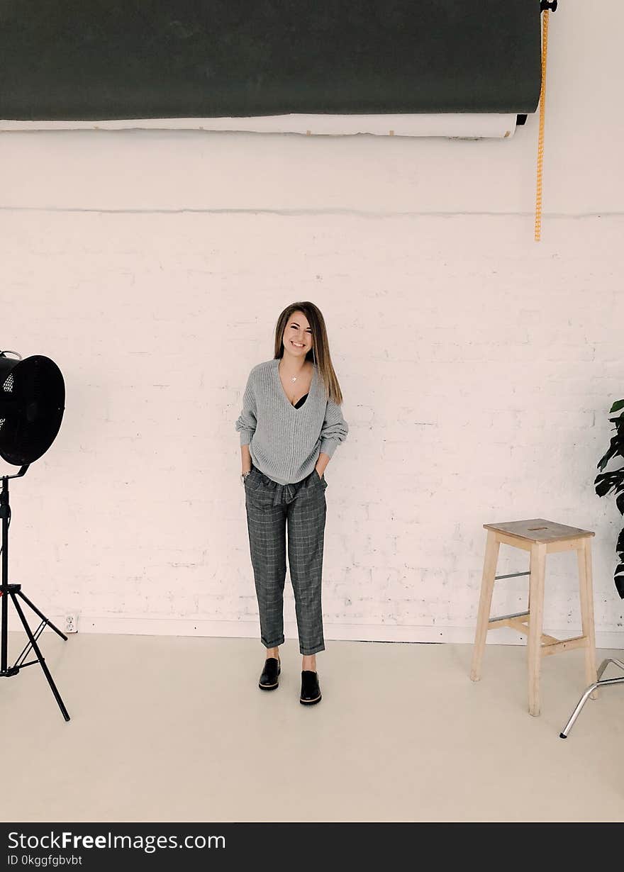 Photo of Woman Wearing Gray Sweater