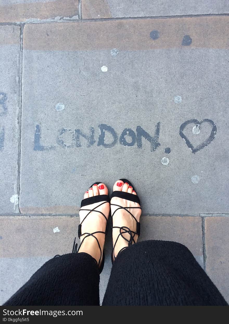 Photo of Woman Wearing Black Sandals