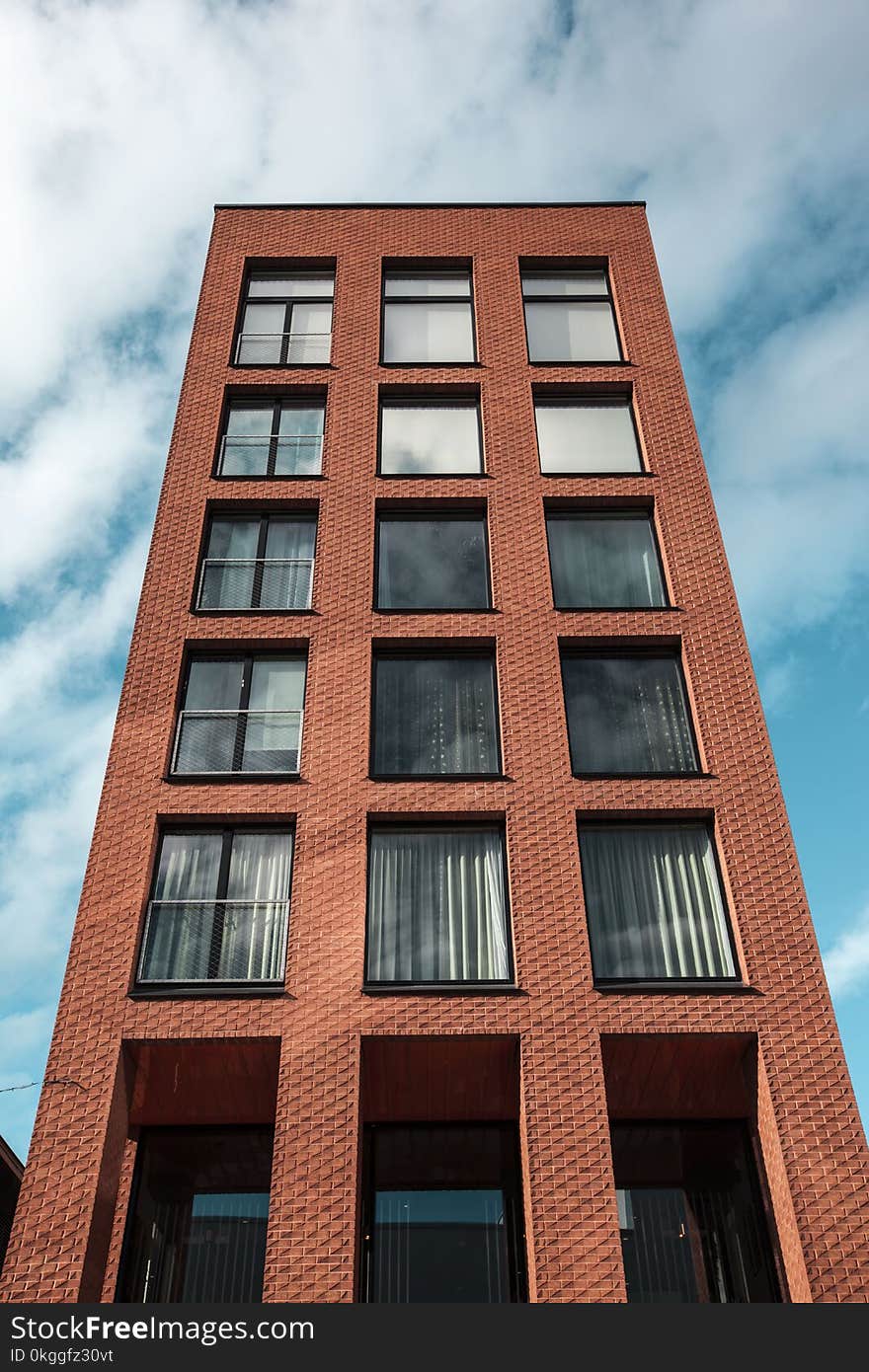 Red and Black Concrete High-rise Building