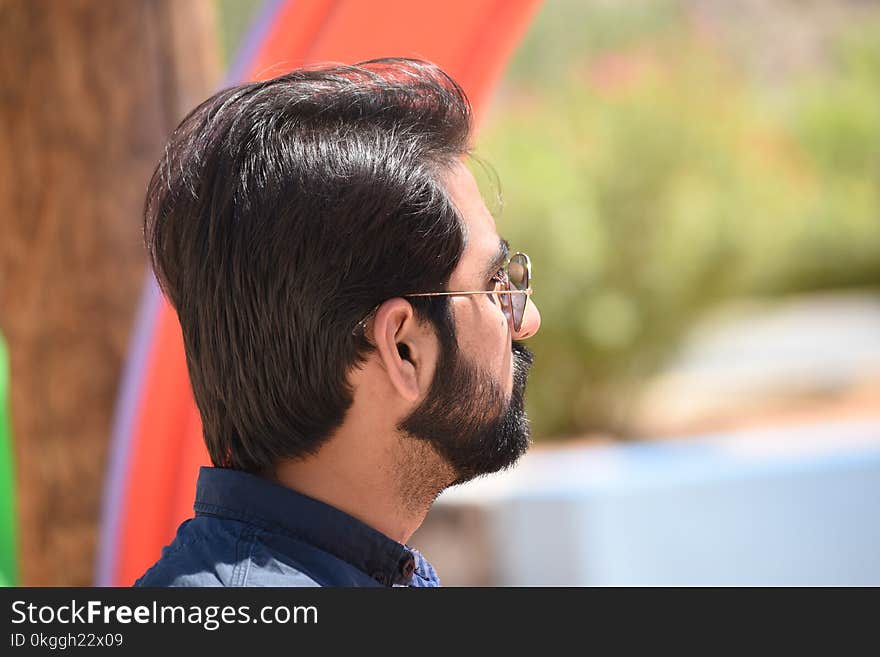 Man Wearing Gold Temple Aviator-style Sunglasses Selective Focus Photography