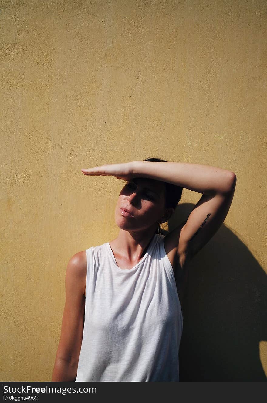 Woman in White Sleeveless Shirt