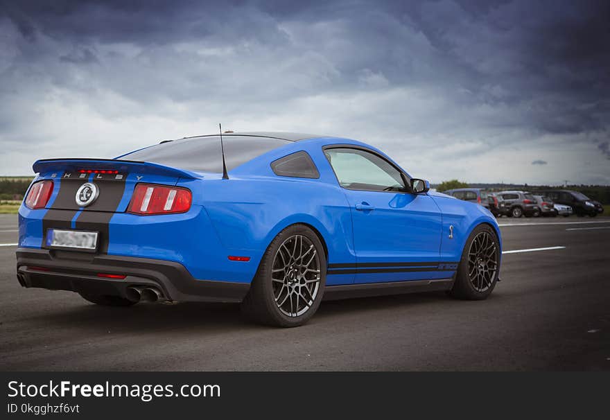 Blue Sports Coupe on Road