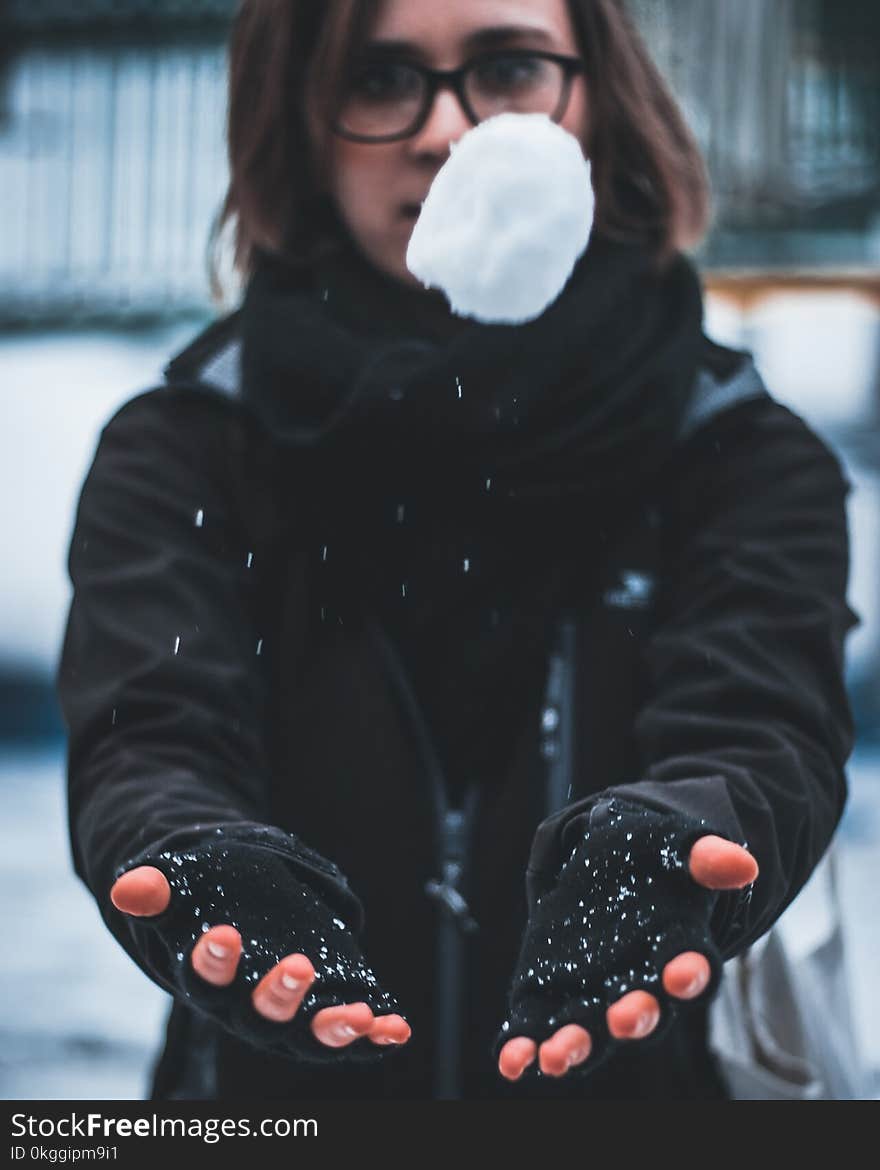 Woman Wearing Black Jacket Holding White Snow