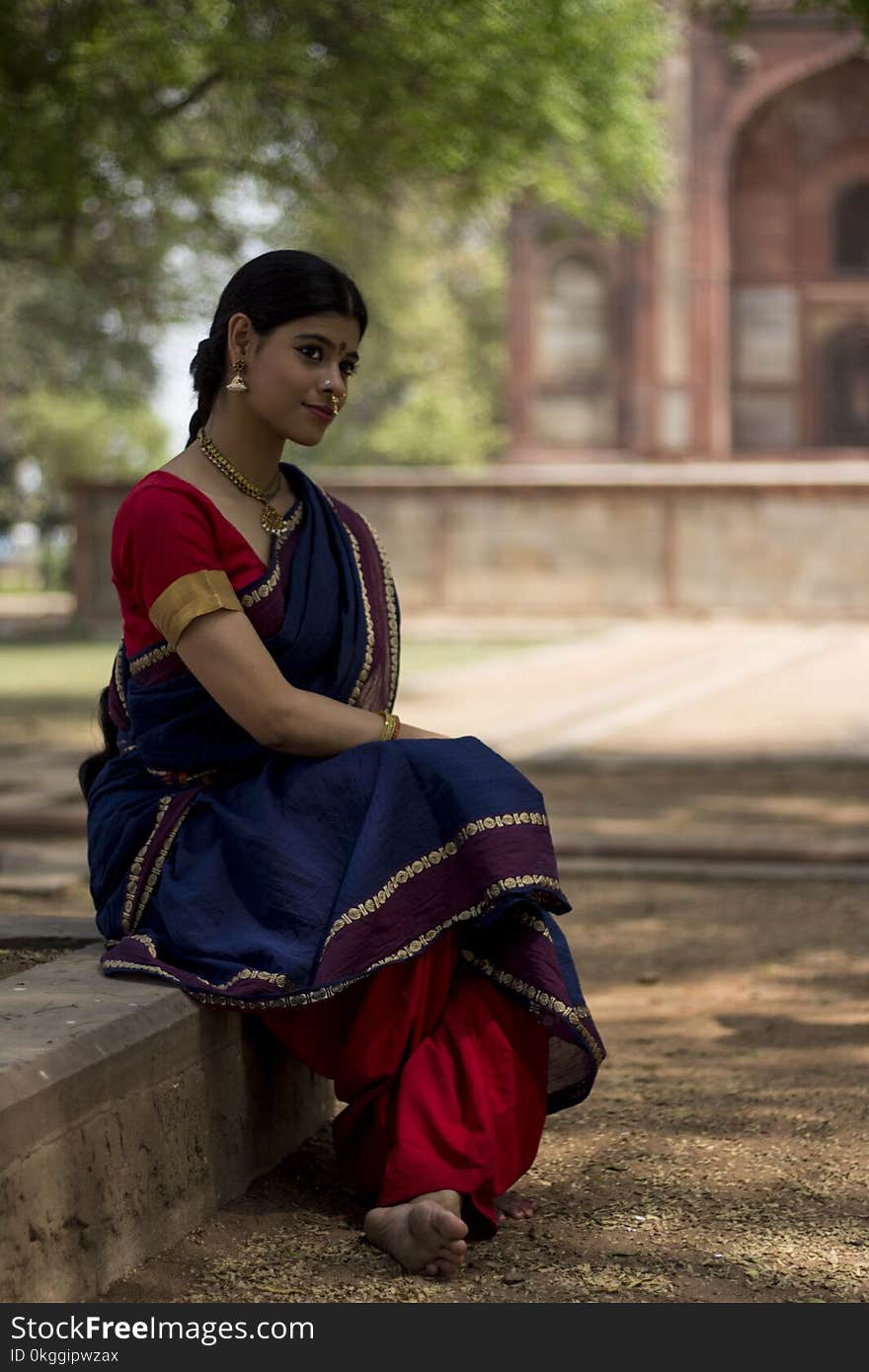 Woman Wearing Blue and Red Dress