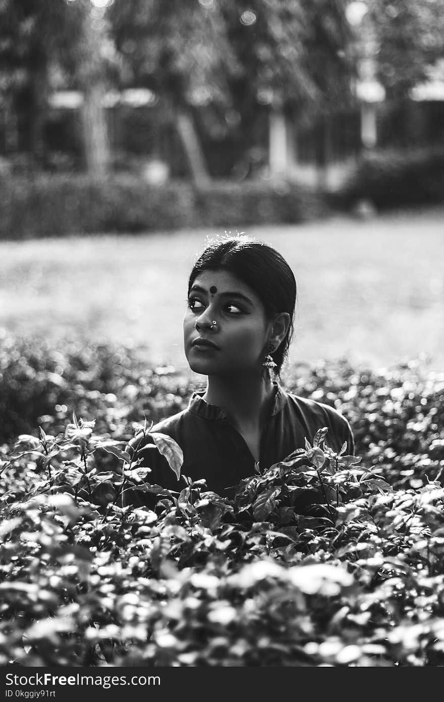 Grayscale Photography of Woman on Garden