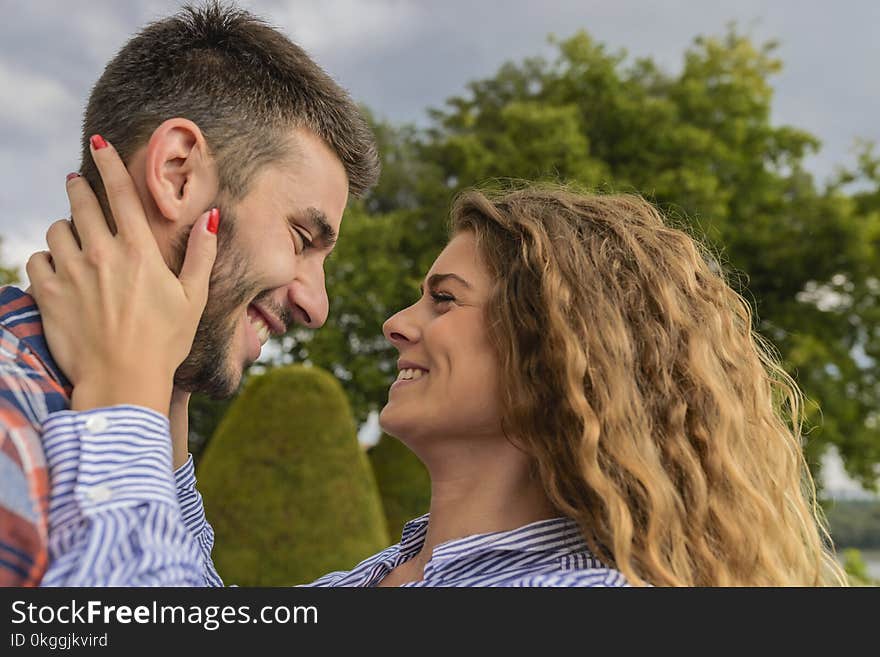 Man and Woman Facing Each Other