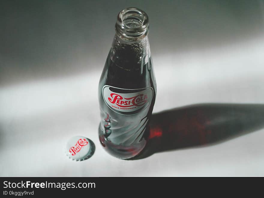 Pepsi-cola Soda Bottle on White Surface