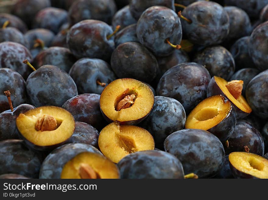 Fresh ripe blue plums close up at farmers market