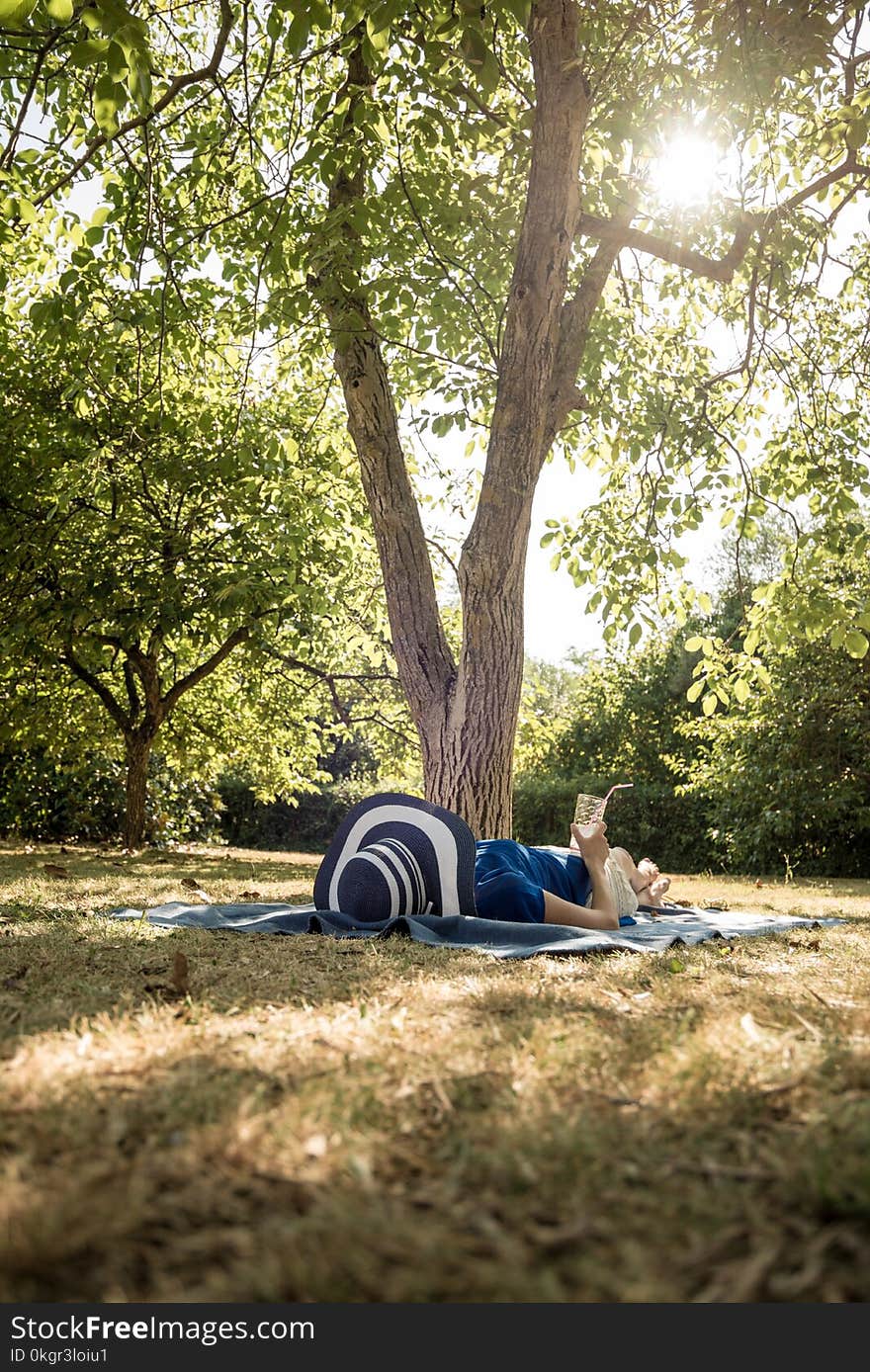 Woman lying relaxing in her back garden