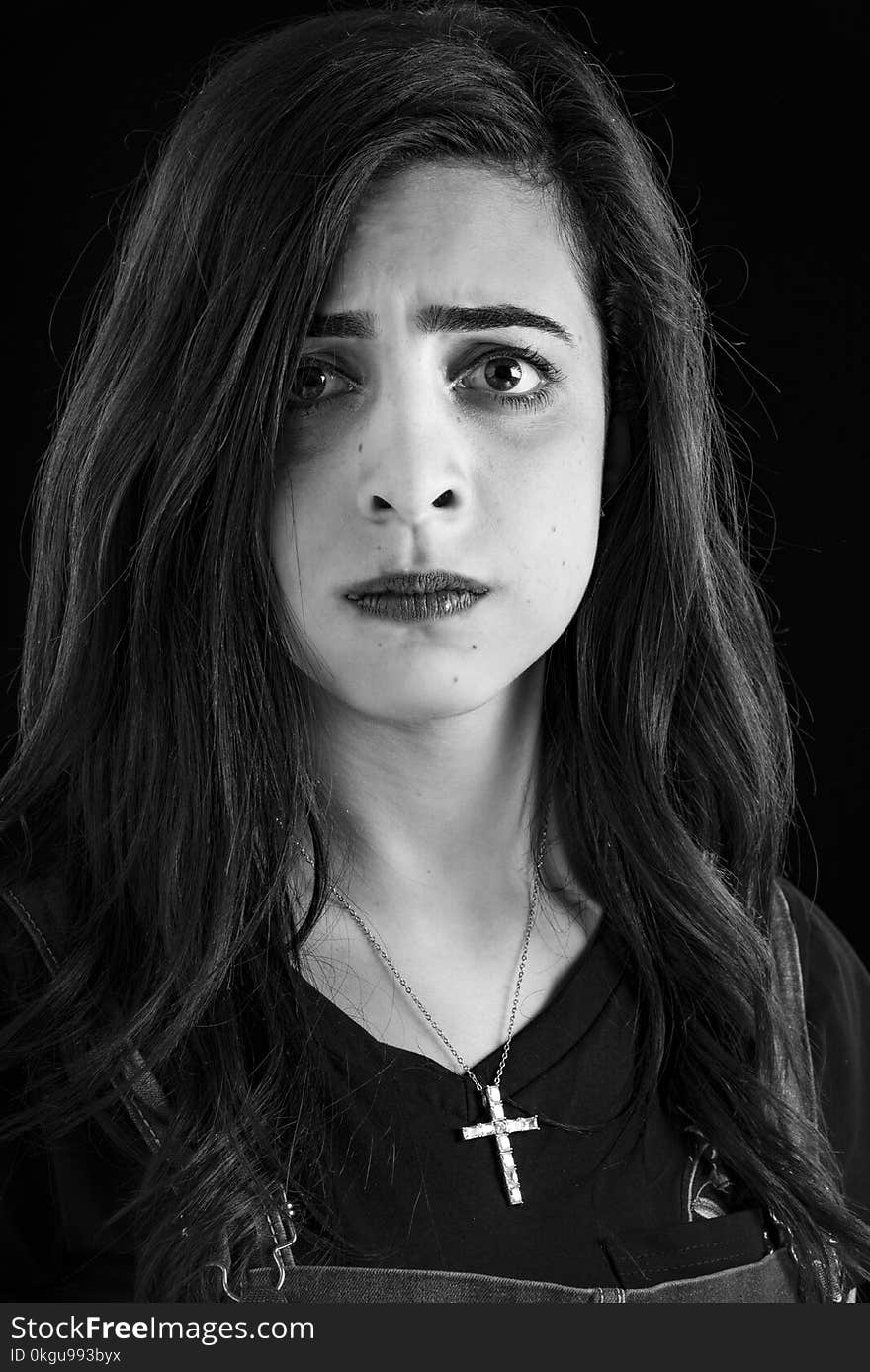 Monochrome Photography of Woman Wearing Cross Necklace