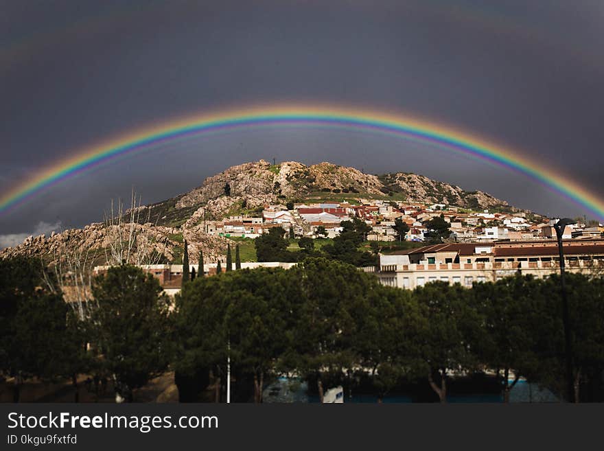 Landscape Photo of the View of City With Rainbow Above