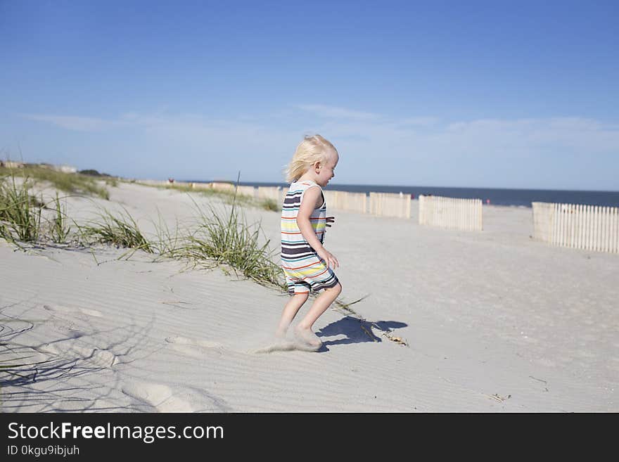 Photography of a Child on Beach